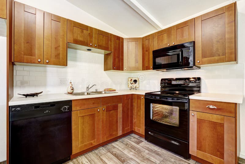 Kitchen cabinets with black appliances