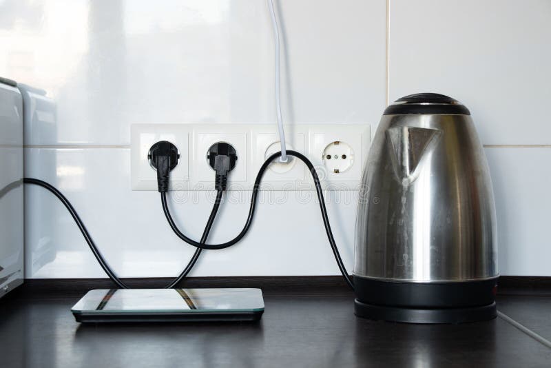 Electric Metallic Kettle with Plug in Socket Stock Photo - Image of  electrical, domestic: 218681954