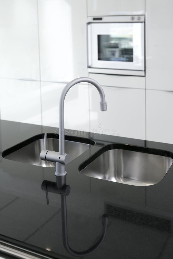 Kitchen faucet and oven modern black and white stock images Kitchen faucet and oven modern black and white stock images