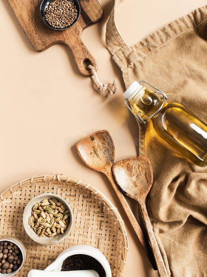 Kitchen Flat Lay of Beige Apron, Small Bowls with Spices, Olive Oil in  Bottle, Wood Kitchen Utensils on Beige Background. Top View Stock Image -  Image of pepper, kitchen: 181265865