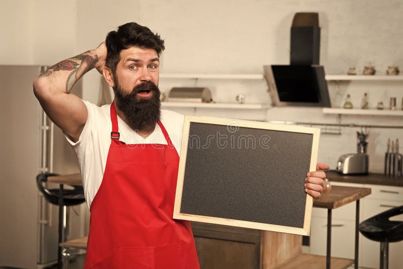 Kitchen hacks concept. Clever ways to organize kitchen. Cook hold blank chalkboard copy space. Secret tips. Useful stock photos Kitchen hacks concept. Clever ways to organize kitchen. Cook hold blank chalkboard copy space. Secret tips. Useful stock photos