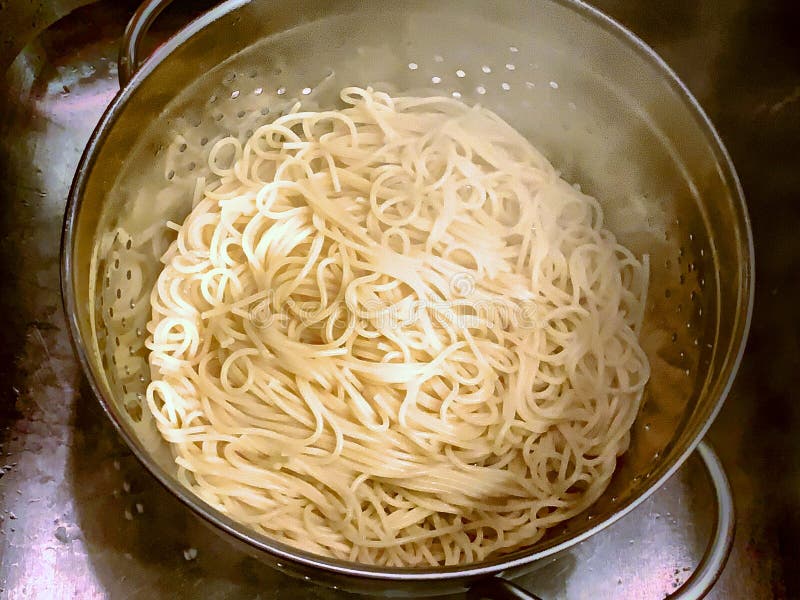 Colander of Steaming Hot Spaghetti Draining Stock Photo - Image of ...