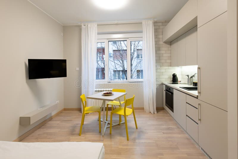 Kitchen Interior with Dining Table and Chairs Stock Image - Image of