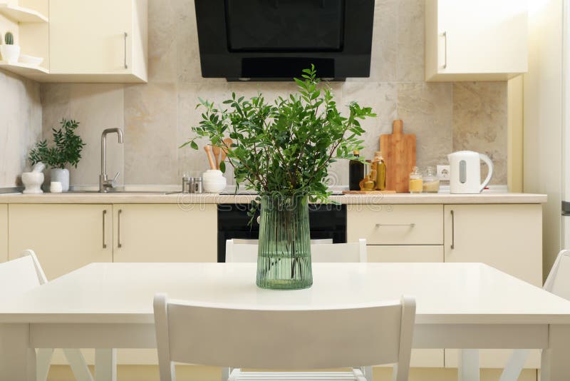Kitchen Interior with Wooden Table with Vase with Plant Stock Image