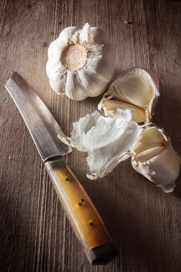 Kitchen knife with garlic stock image. Image of cooking 34808375
