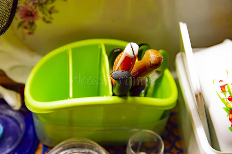 Kitchen knives in a green stand stock photo Kitchen knives in a green stand stock photo