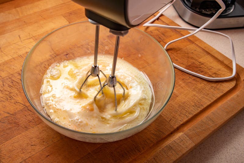 Kitchen mixer and mixing tasty cake. Home work in the kitchen