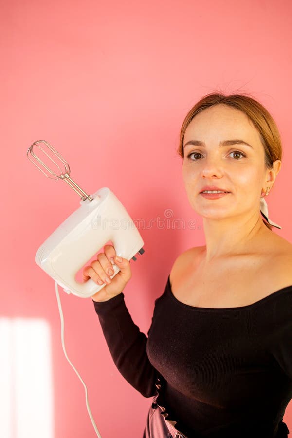 Kitchen Mixer in a Woman`s Hand. Woman Holds Electric Mixer on ...