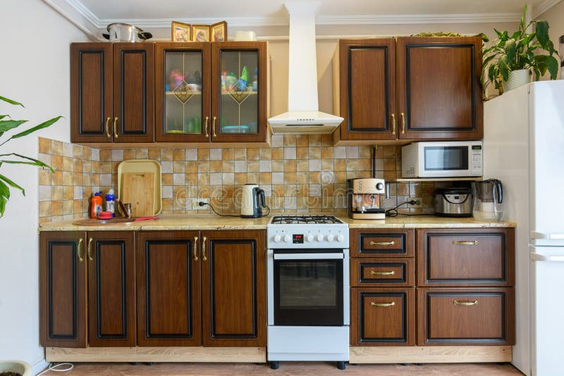 Kitchen Set for Dark Wood in a Standard Apartment Stock Photo Image