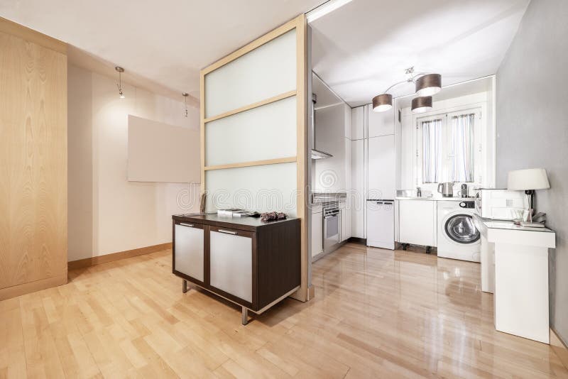 Kitchen of a Shortterm Rental Apartment with Lightcolored Stock Image