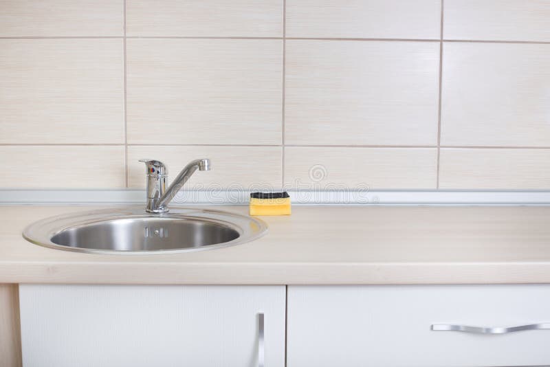 Kitchen sink with sponge