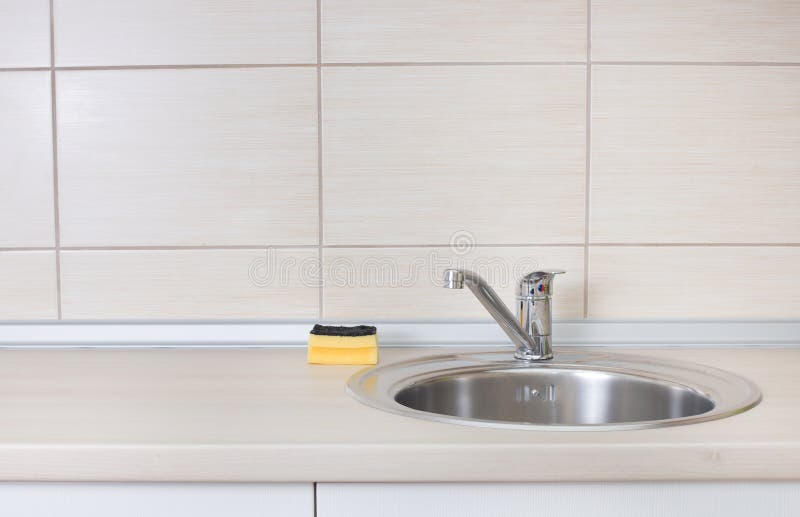 Kitchen sink with sponge