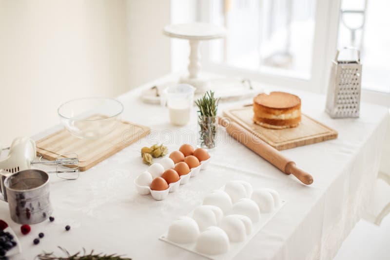 Kitchen Table with Tools and Ingredients for Making Dessert Stock Image