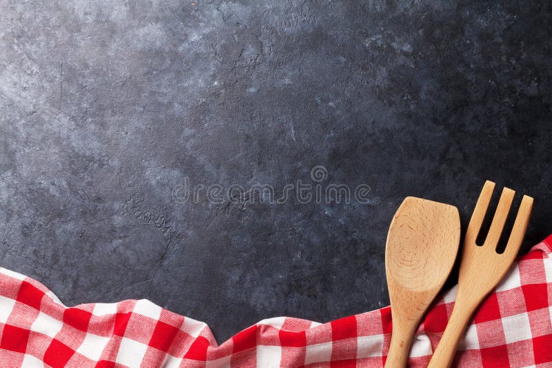 Kitchen table with towel and utensil