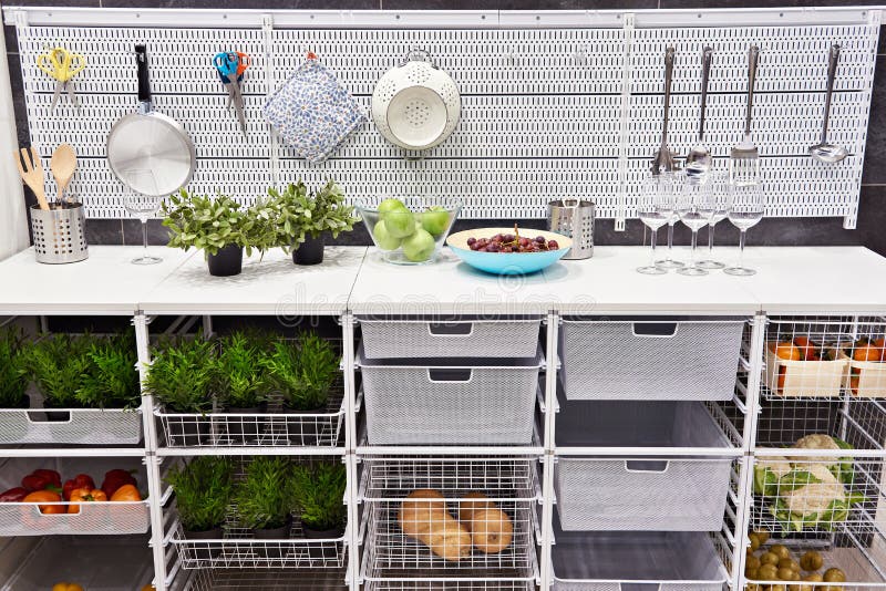 Kitchen Table with Utensils and Storage Boxes for Vegetables Stock