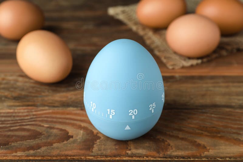Kitchen Timer and Eggs on Wooden Table Stock Photo Image of equipment