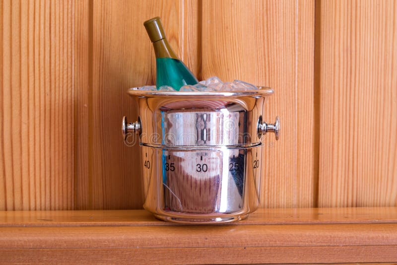 Kitchen timer shaped like champagne bottle on a wood background stock images Kitchen timer shaped like champagne bottle on a wood background stock images