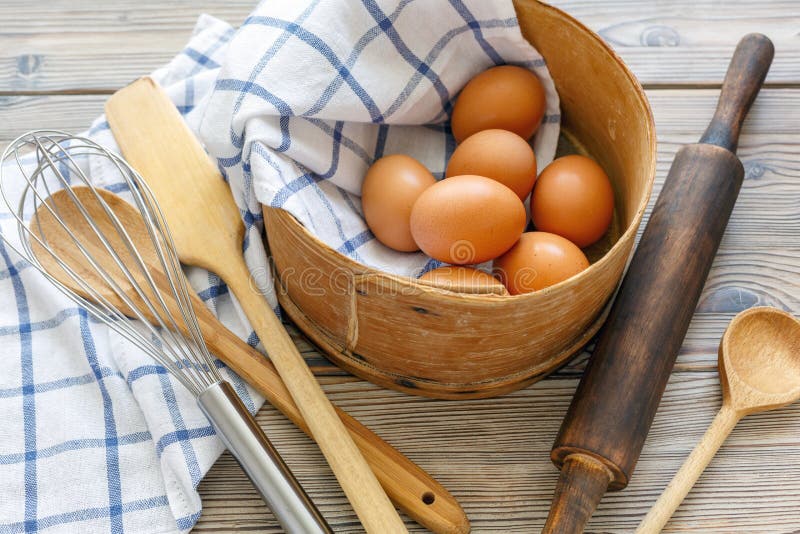 Kitchen Utensils And Brown Eggs In An Old Sieve. Stock Photo Image of