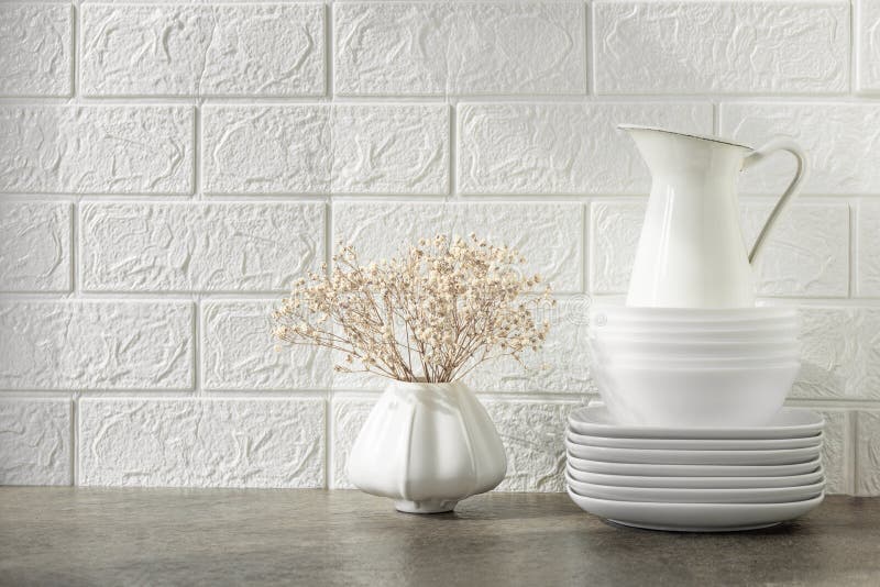 Kitchen Utensils and Crockery on a Shelf or Table. White Kitchen