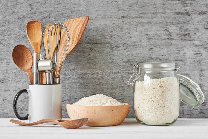 Glass Jar with Rice and Wooden Bowl, Front View Stock Image - Image of ...