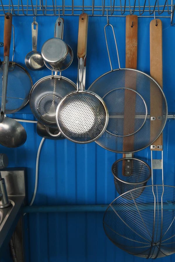 Kitchen Utensils Hanging on the Rack, Bangkok, Thailand. Stock Image