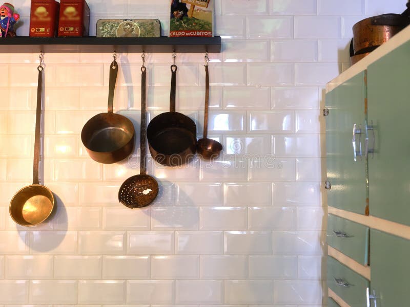 Kitchen Utensils Hanging from Shelves in Tyhe Kitchen of a Restaurant