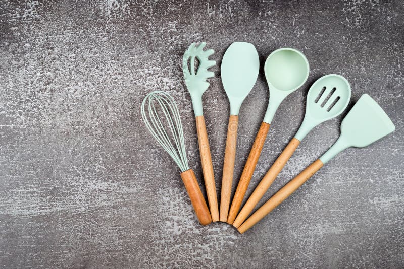 Kitchen utensils, home kitchen tools, mint rubber accessories on dark  background. Restaurant, cooking, culinary, kitchen theme. Silicone spatulas  and brushes Stock Photo by ©Magryt_Artur 441739308