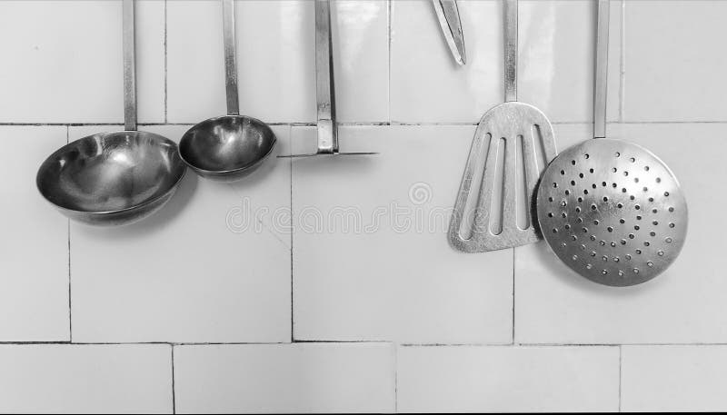 Kitchen Utensils on the White Tile