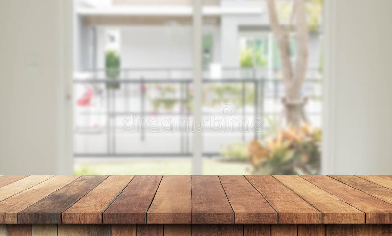Kitchen wood table top for product display with blurred modern interior. stock photos
