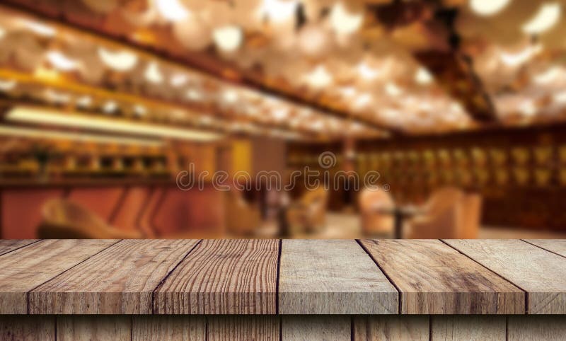 Kitchen wood table top for product display with blurred modern interior. Wooden tabletop over defocused kitchen background. stock image