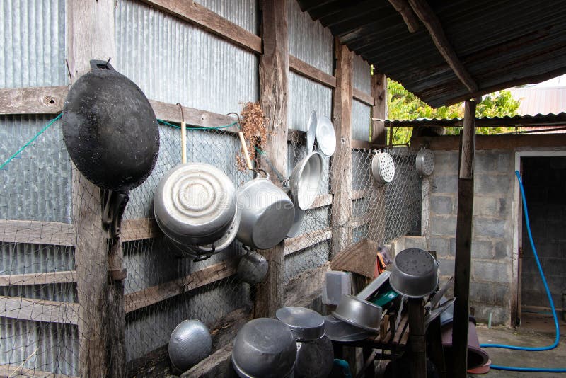 Kitchenware Various Sized Metal Pan Pot Hanging in Row on Hooks