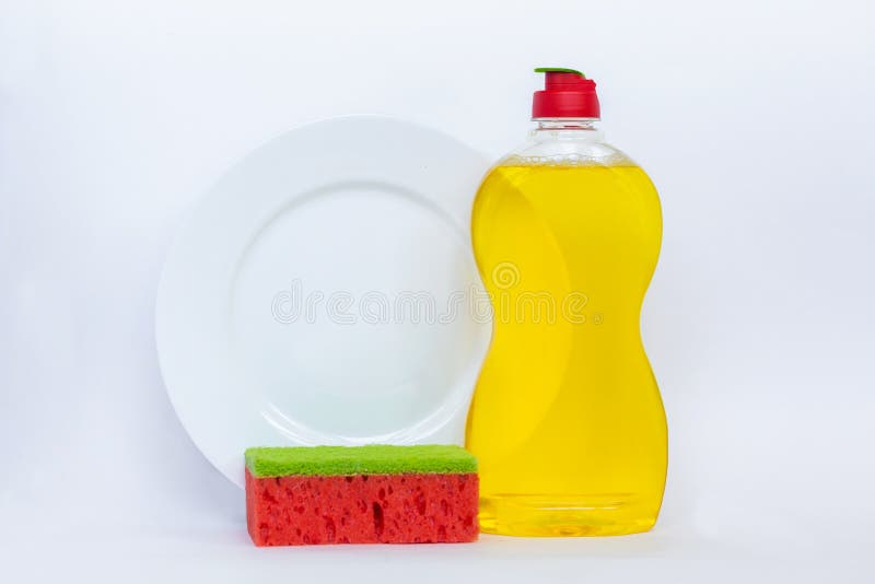 Kitchenware моя желтую жидкость, чистую бутылку, чистую плиту и стоковые изображения rf Kitchenware моя желтую жидкость, чистую бутылку, чистую плиту и стоковые изображения rf