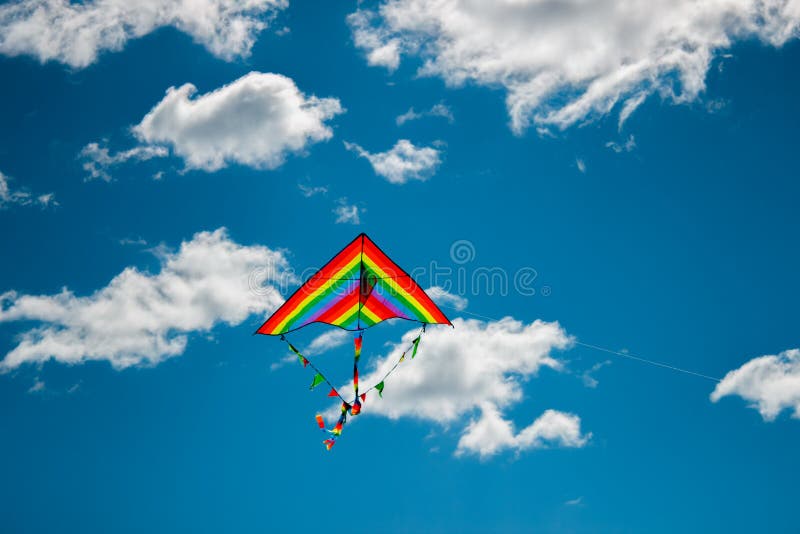 Kite flying in the sky stock image. Image of blue, sunshine 91532353