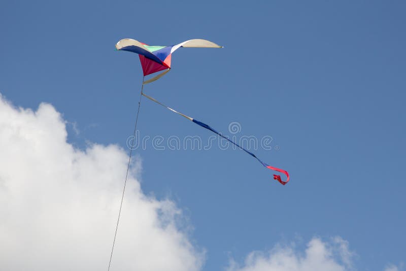 Kite flying in the wind stock image. Image of string 63993179