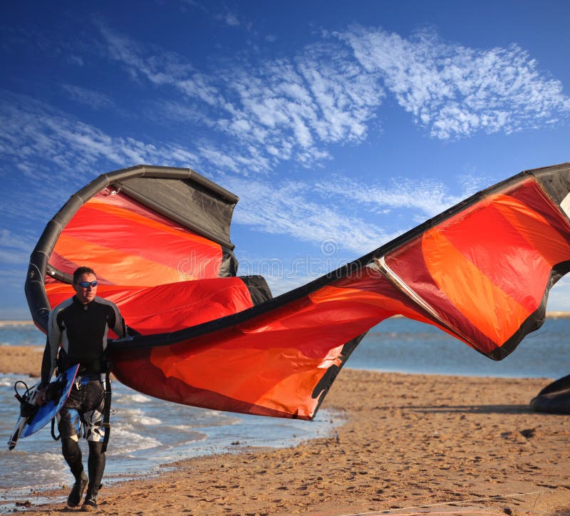 Kite surfer on the beach stock image Kite surfer on the beach stock image