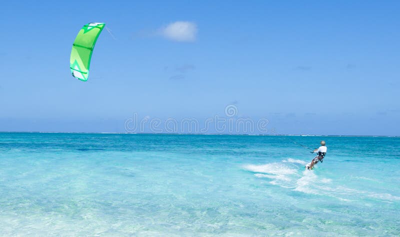 Kitesurfer on clear blue tropical lagoon water, Okinawa, Japan
