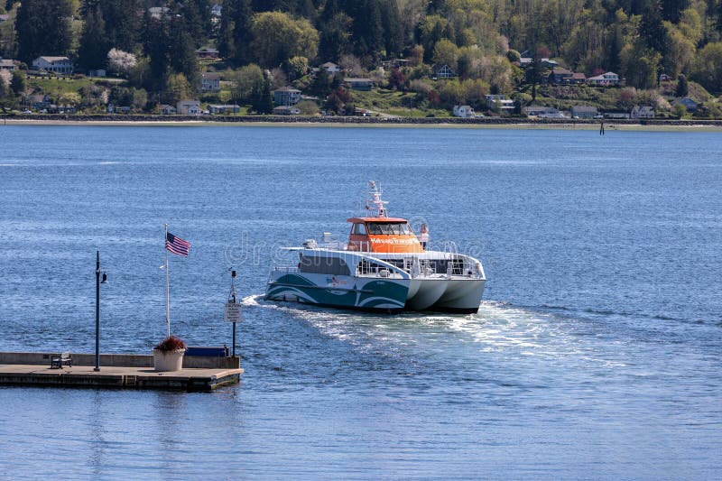 A Kitsap Fast Ferry departs the Bremerton port stock photo