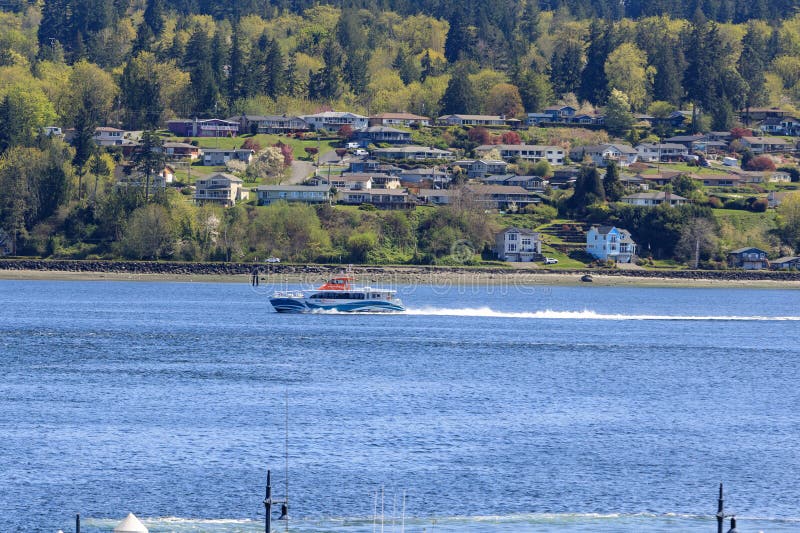 A Kitsap Fast Ferry departs the Bremerton port royalty free stock photos