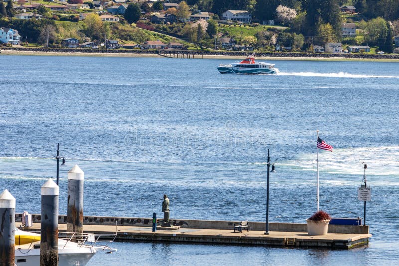 A Kitsap Fast Ferry departs the Bremerton port royalty free stock image