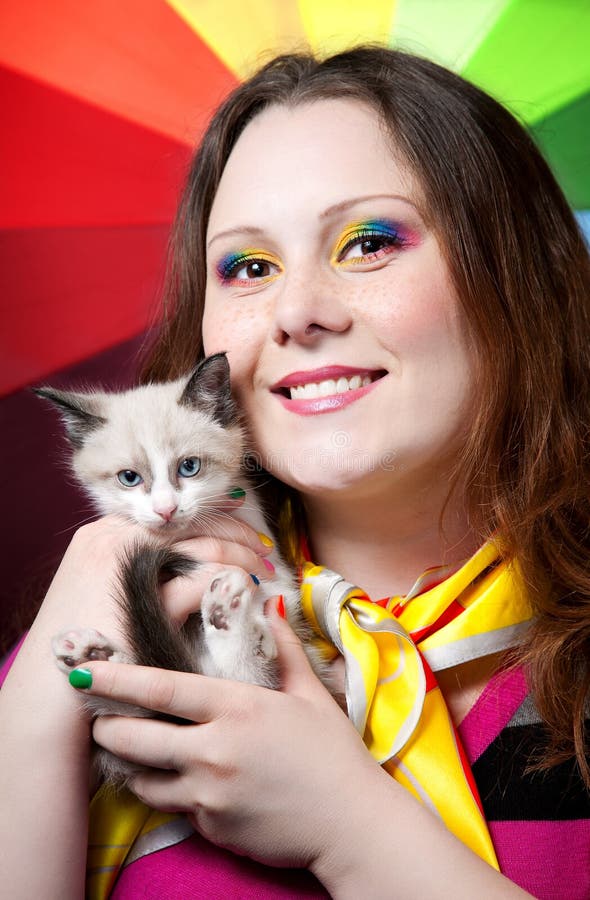 Kitten and Woman with rainbow make up stock photos Kitten and Woman with rainbow make up stock photos
