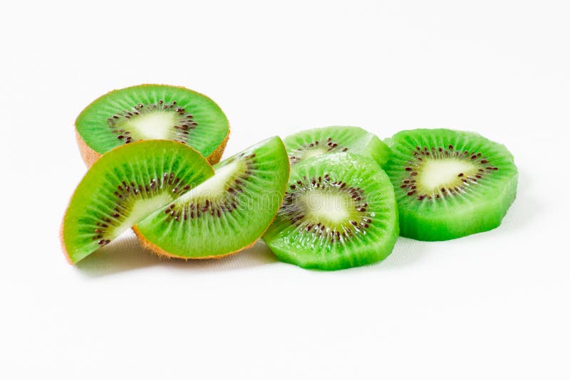 Kiwi fruit and his slices on white