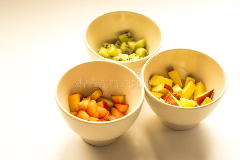 Kiwi, Peach and Plum in White Bowls Stock Photo Image of nature