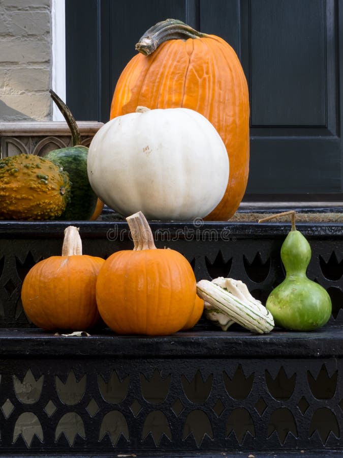 Halloween ready house patio wtih assorted pumpkins. Halloween ready house patio wtih assorted pumpkins