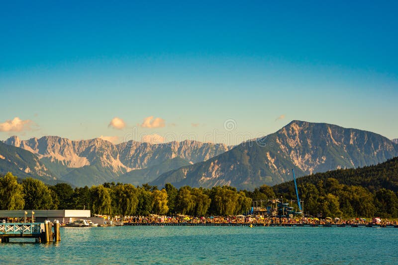 Klagenfurt, Austria 08.08.2016: Great lake Klagenfurt am Worthersee. The large lake of Klagenfurt in Austria. Many boats. Are anchored. Summer holiday resort royalty free stock images Klagenfurt, Austria 08.08.2016: Great lake Klagenfurt am Worthersee. The large lake of Klagenfurt in Austria. Many boats. Are anchored. Summer holiday resort royalty free stock images