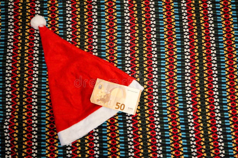 ready for christmas background with hat and 50 euro banknote. ready for christmas background with hat and 50 euro banknote