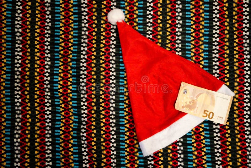 ready for christmas background with hat and 50 euro banknote. ready for christmas background with hat and 50 euro banknote