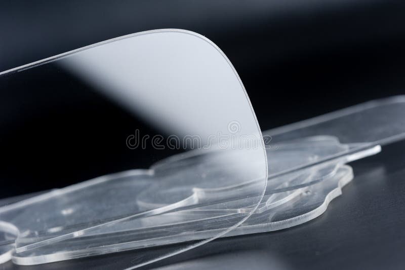 Closeup clear acrylic template, acrylic plastic material. Closeup clear acrylic template, acrylic plastic material