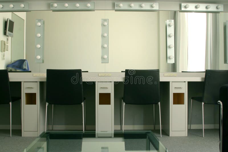 Dressing room backstage at a theater, including lighted mirrors and multiple makeup stations to accommodate four people at once. Dressing room backstage at a theater, including lighted mirrors and multiple makeup stations to accommodate four people at once.