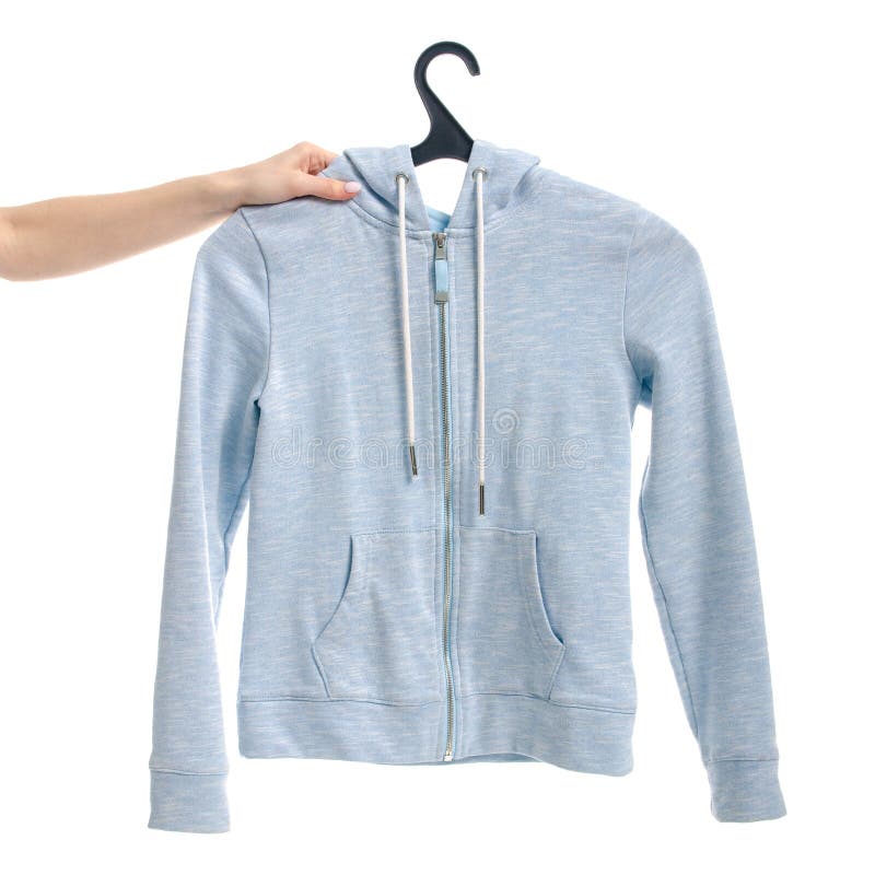 Kleidet blaues Sweatshirt auf dem Verschluss auf einer weiblichen Hand des Aufhängers stockfotografie Kleidet blaues Sweatshirt auf dem Verschluss auf einer weiblichen Hand des Aufhängers stockfotografie