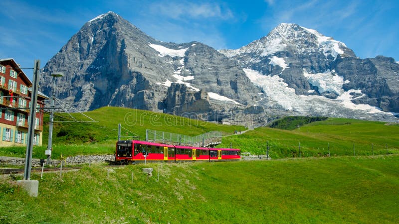 Red Jungfraubahn train from Jungfraujoch near Kleine Scheidegg